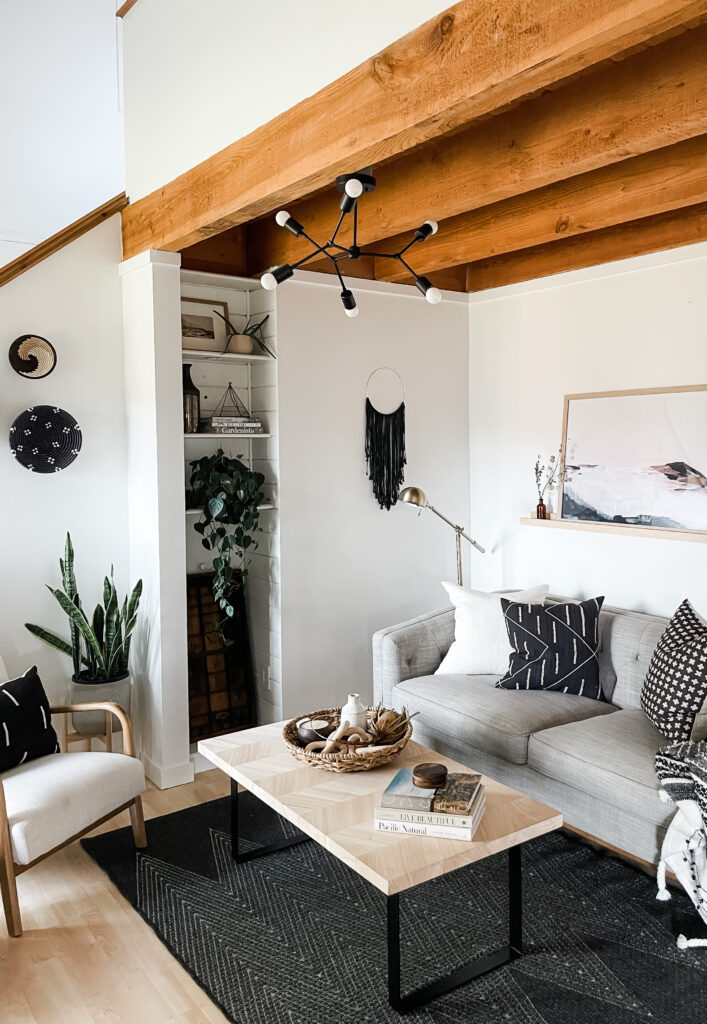 boho living room with mid century modern light