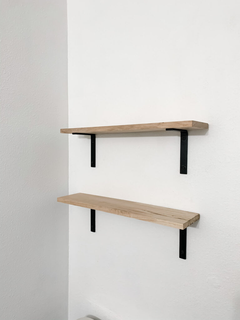 bathroom shelves make great use of space of above toilet