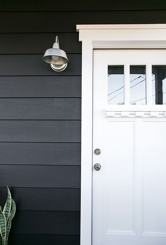 modern black house with white trim