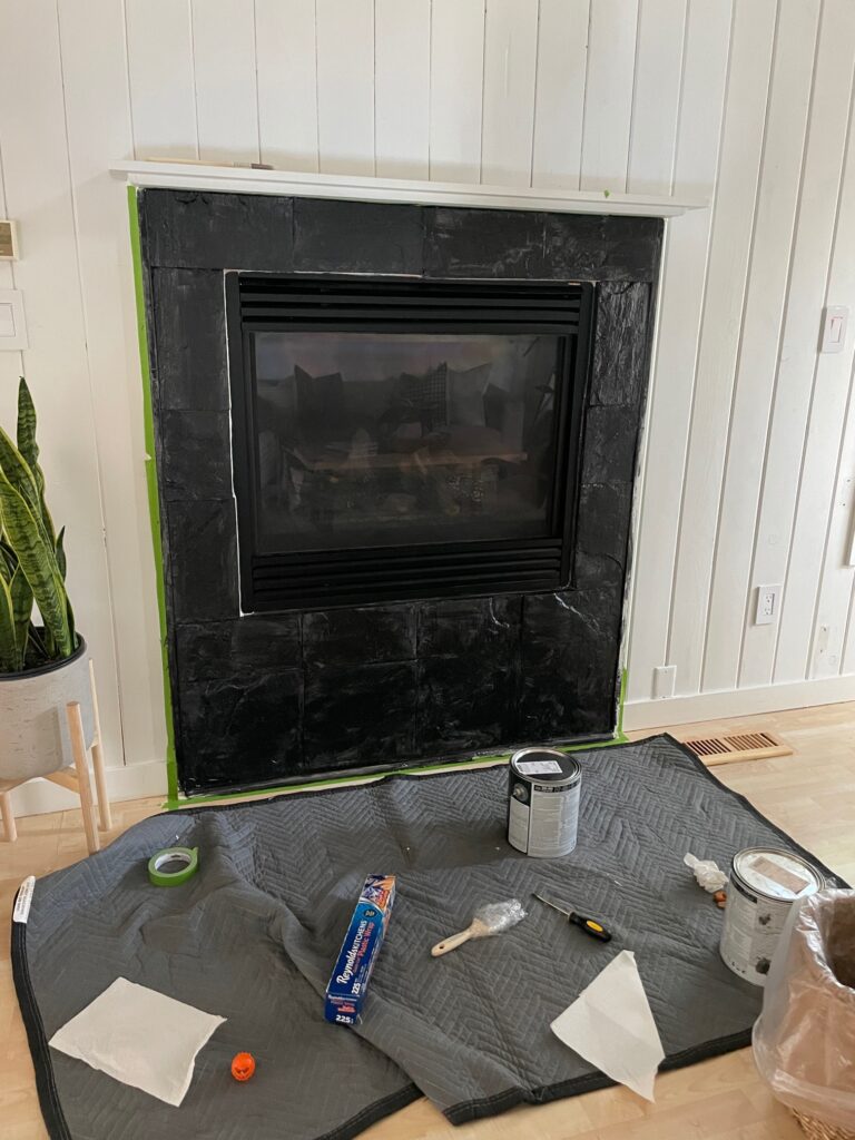 black painted stone fireplace