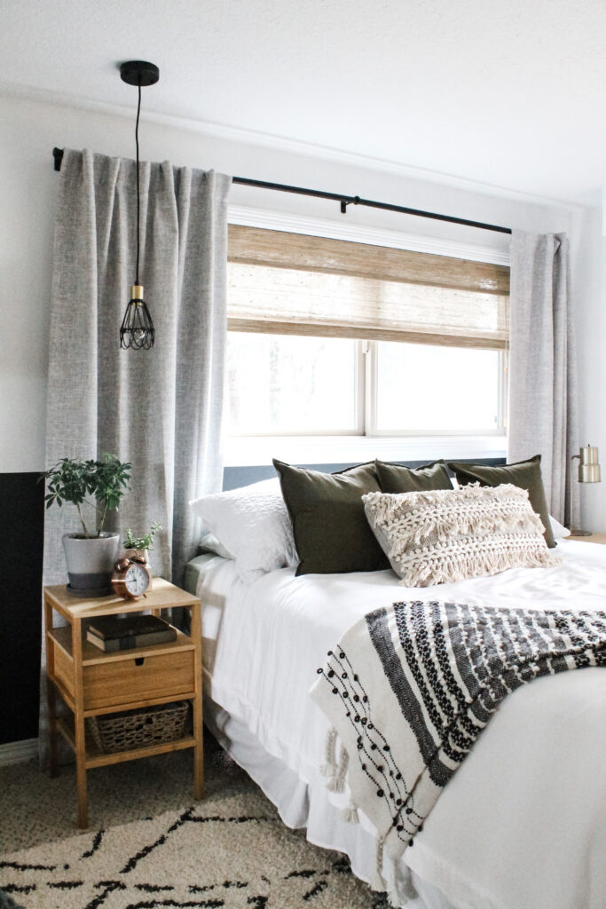 boho bedroom with textured pillows and and bed