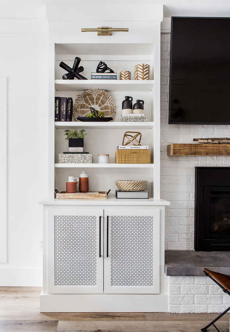white built in cabinet with decor