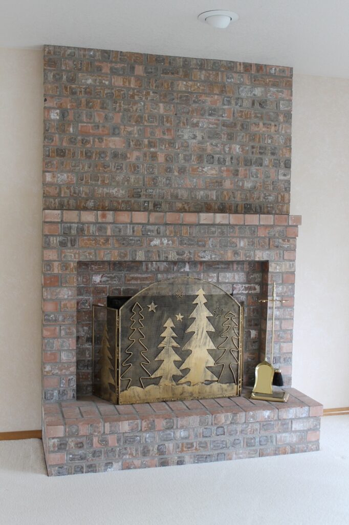 brick fireplace before whitewashing