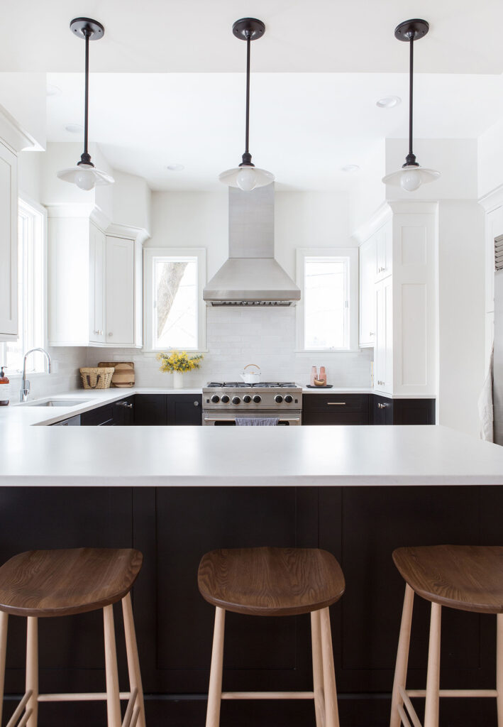 kitchen with black cabinets and white tile