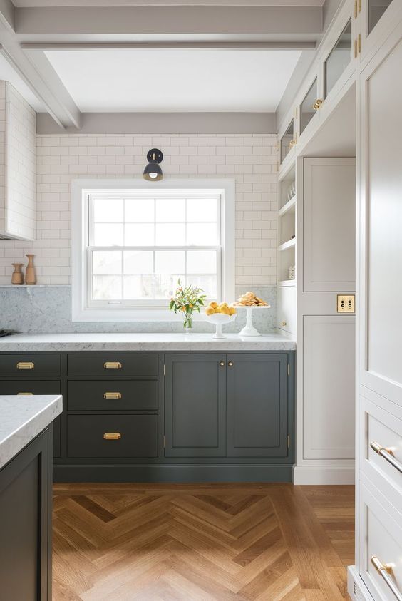 lower dark cabinets and brass pulls