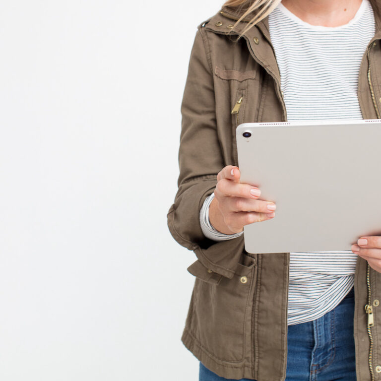 woman holding tablet