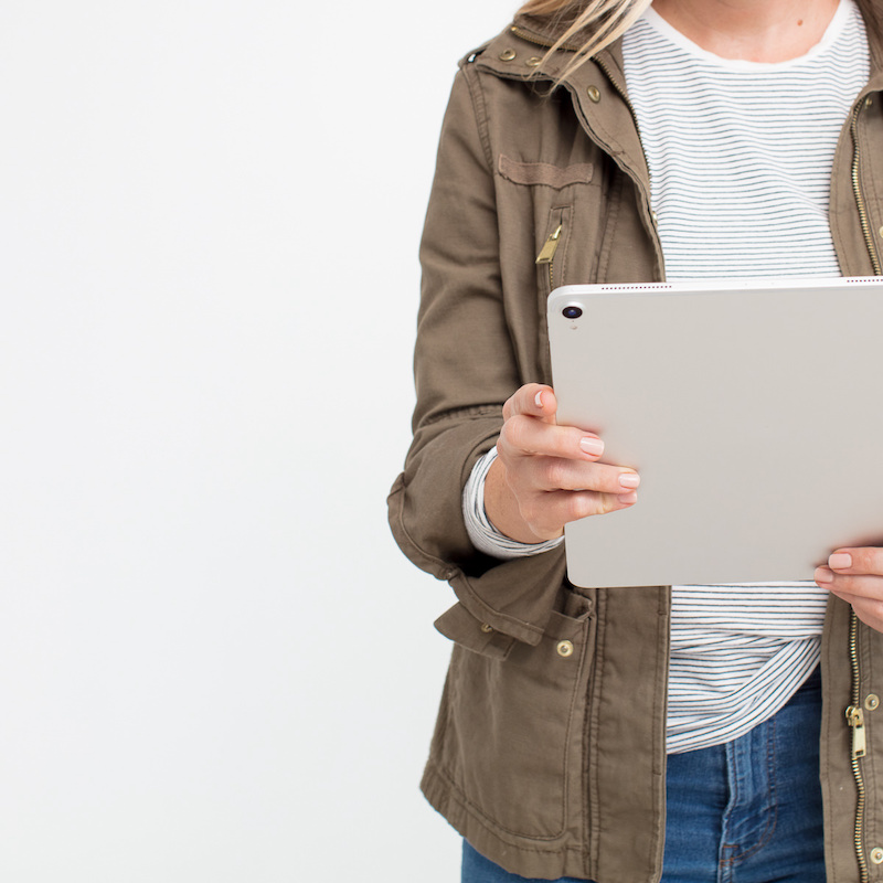 woman holding a tablet