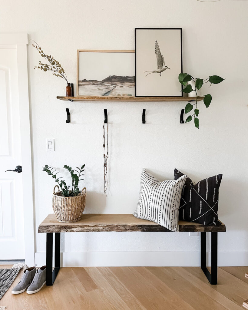 entryway bench with shelf and art work
