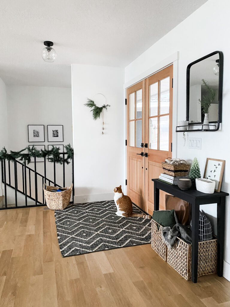 modern holiday decor with minimal Christmas wreath and fresh greenery in entryway