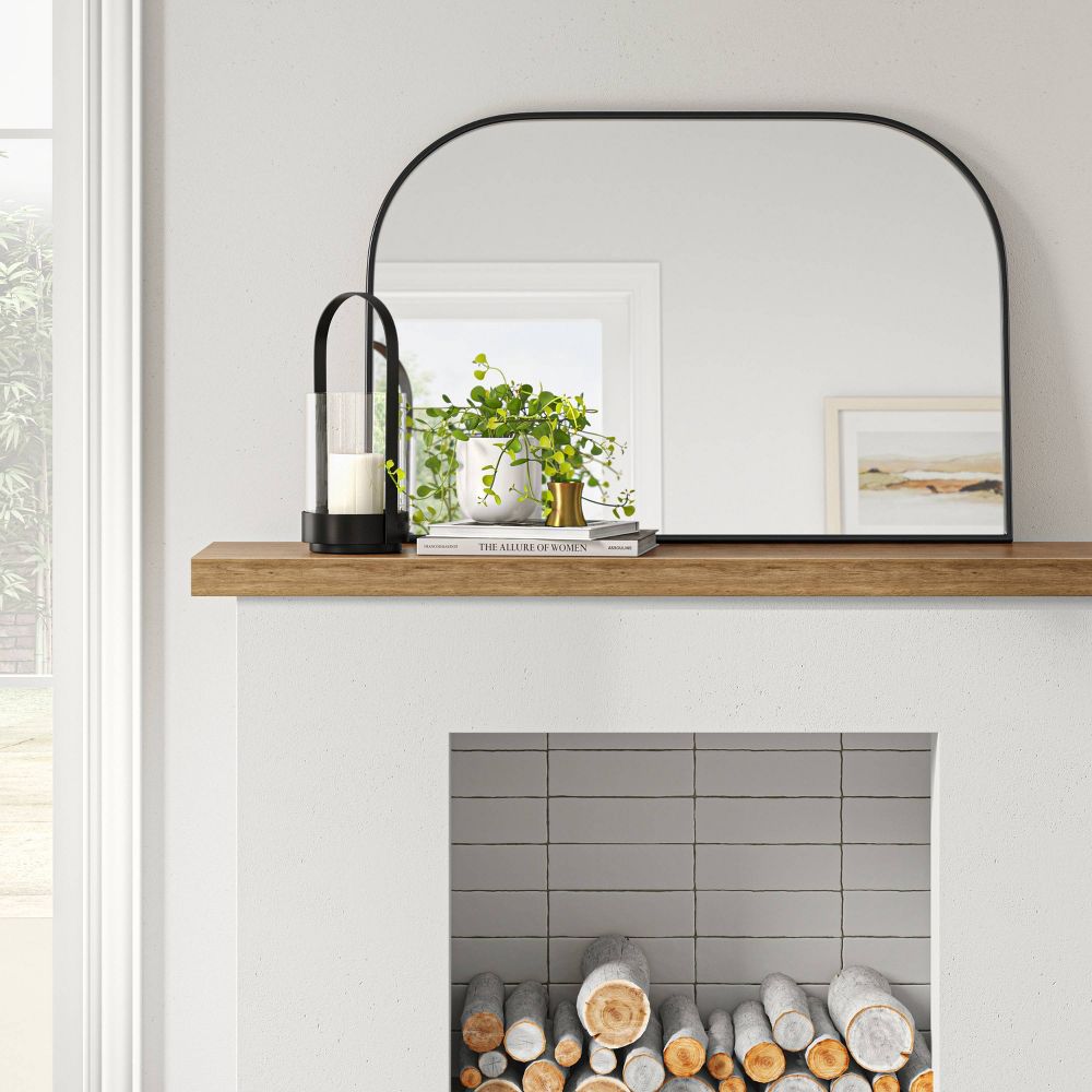 arched mantel mirror on fireplace