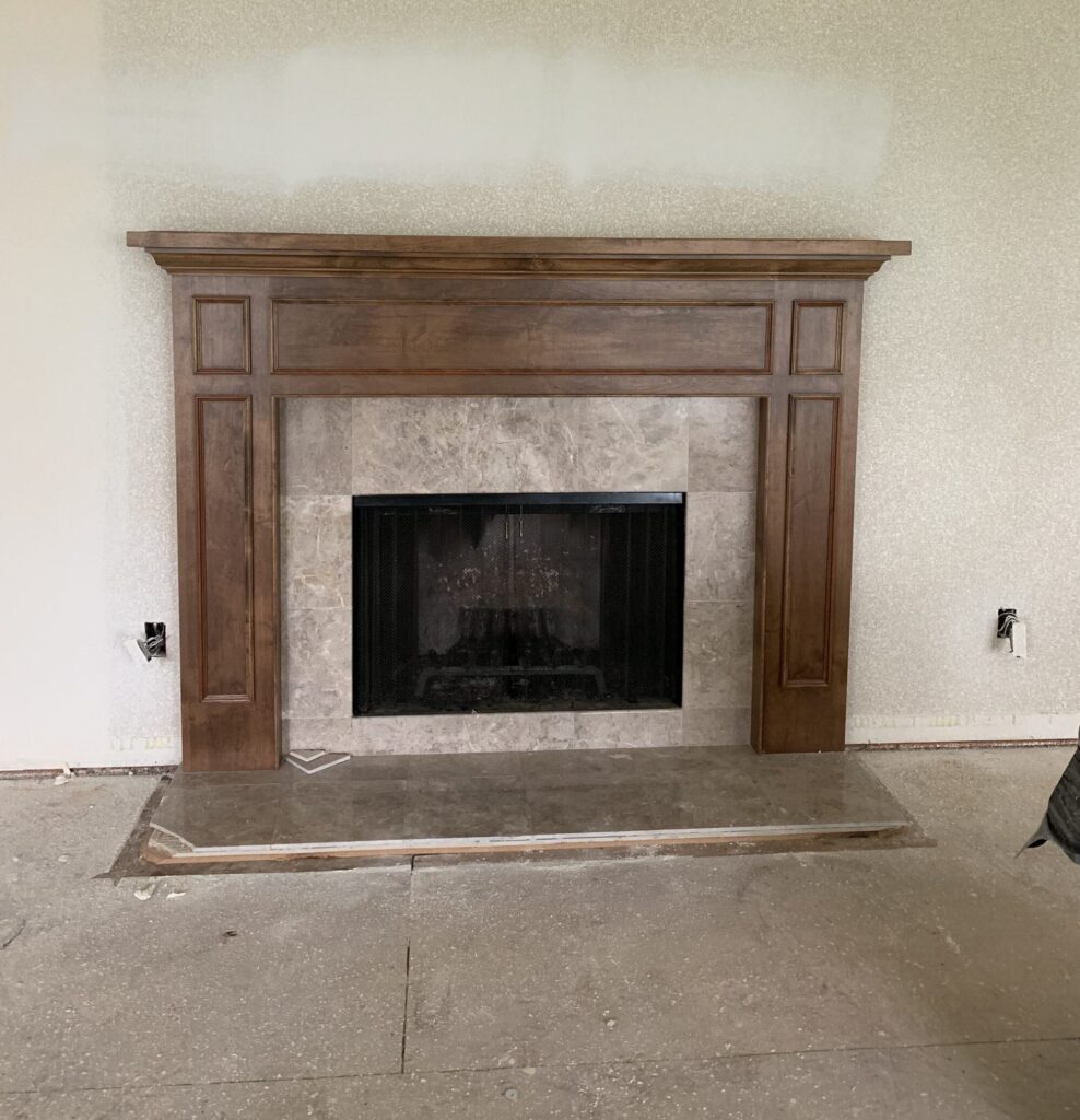 outdated fireplace before painting