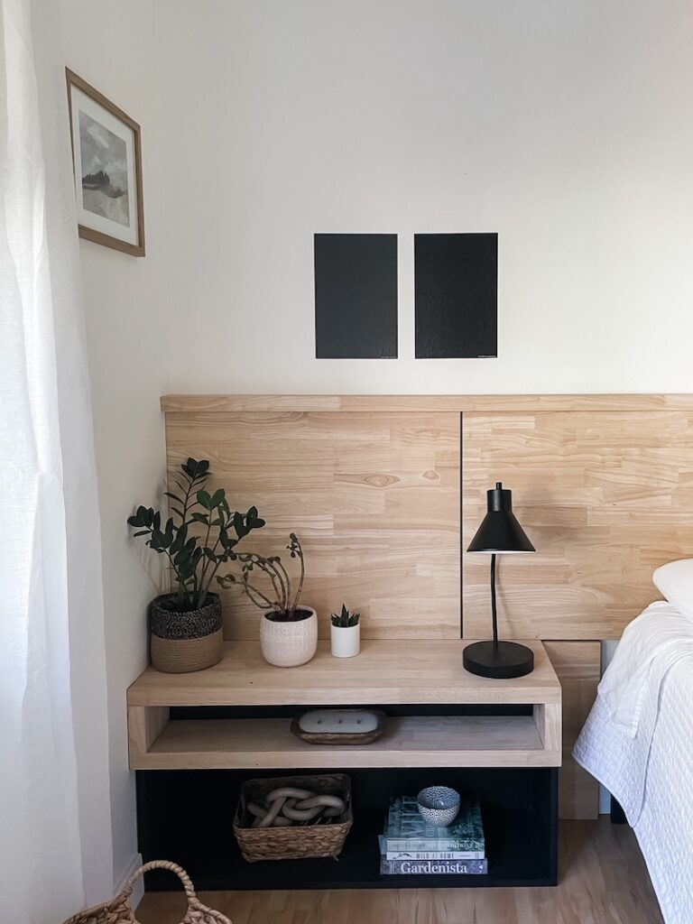 bedroom wall with black paint samples