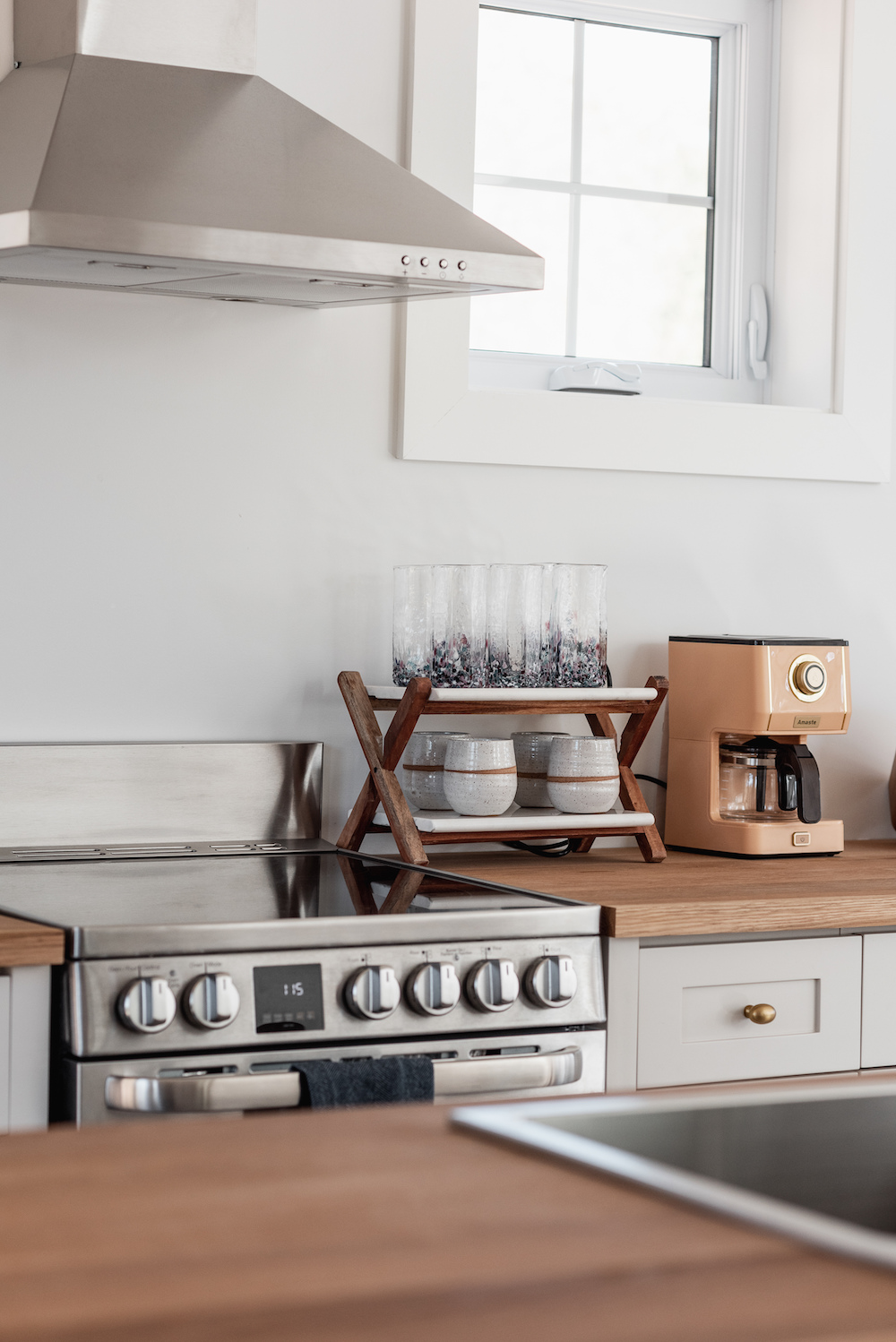 modern kitchen with oven and coffee bar