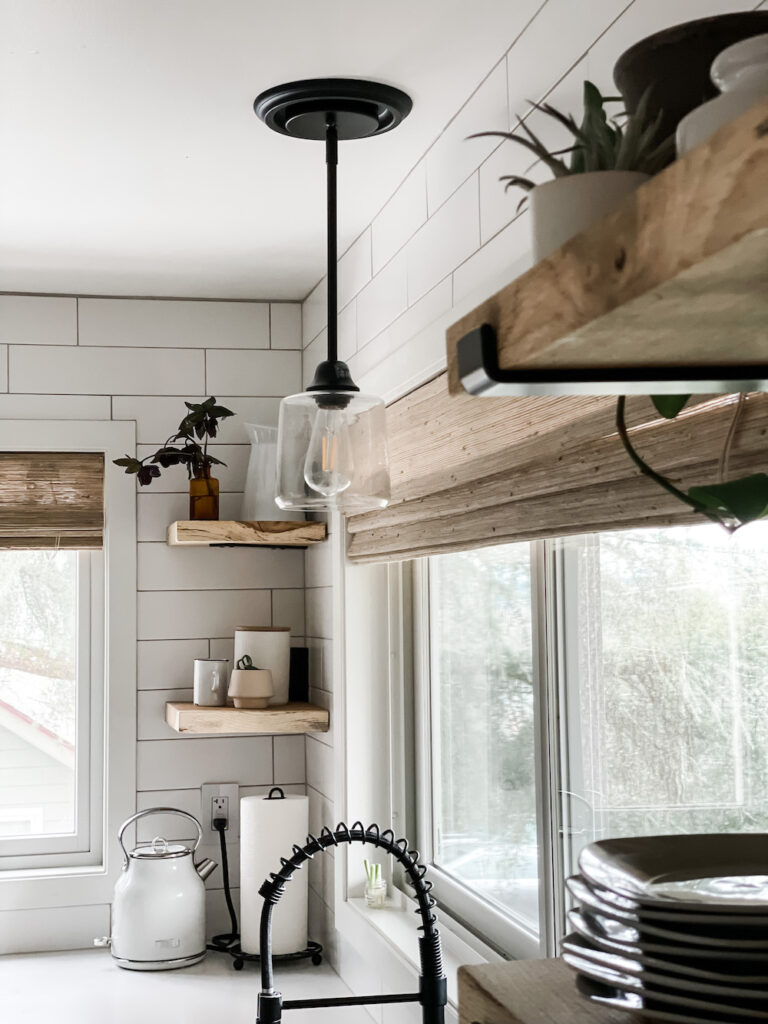 kitchen above the sink light and woven wood shades