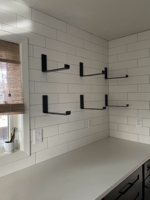 heavy duty shelf brackets for open shelving on white kitchen tile backsplash