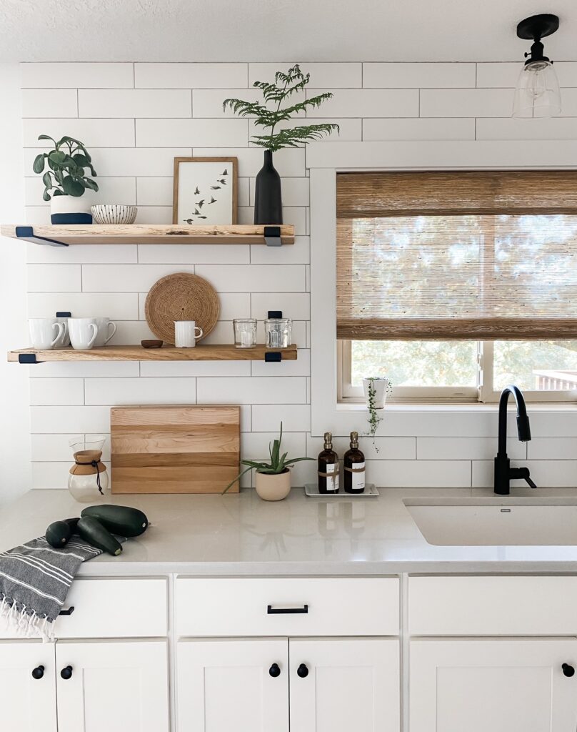 white kitchen with shelves and decor