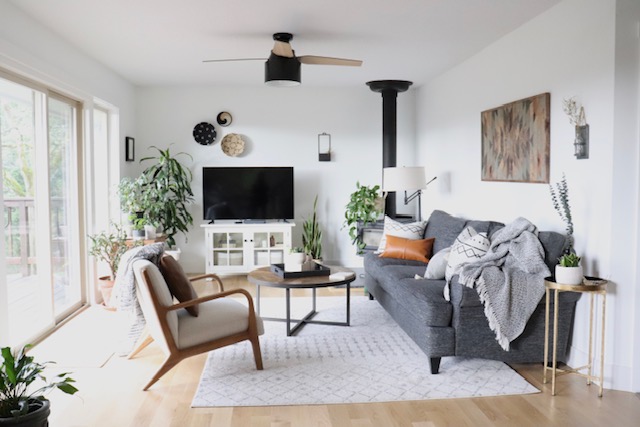 living room with couch, chair, table, and rug