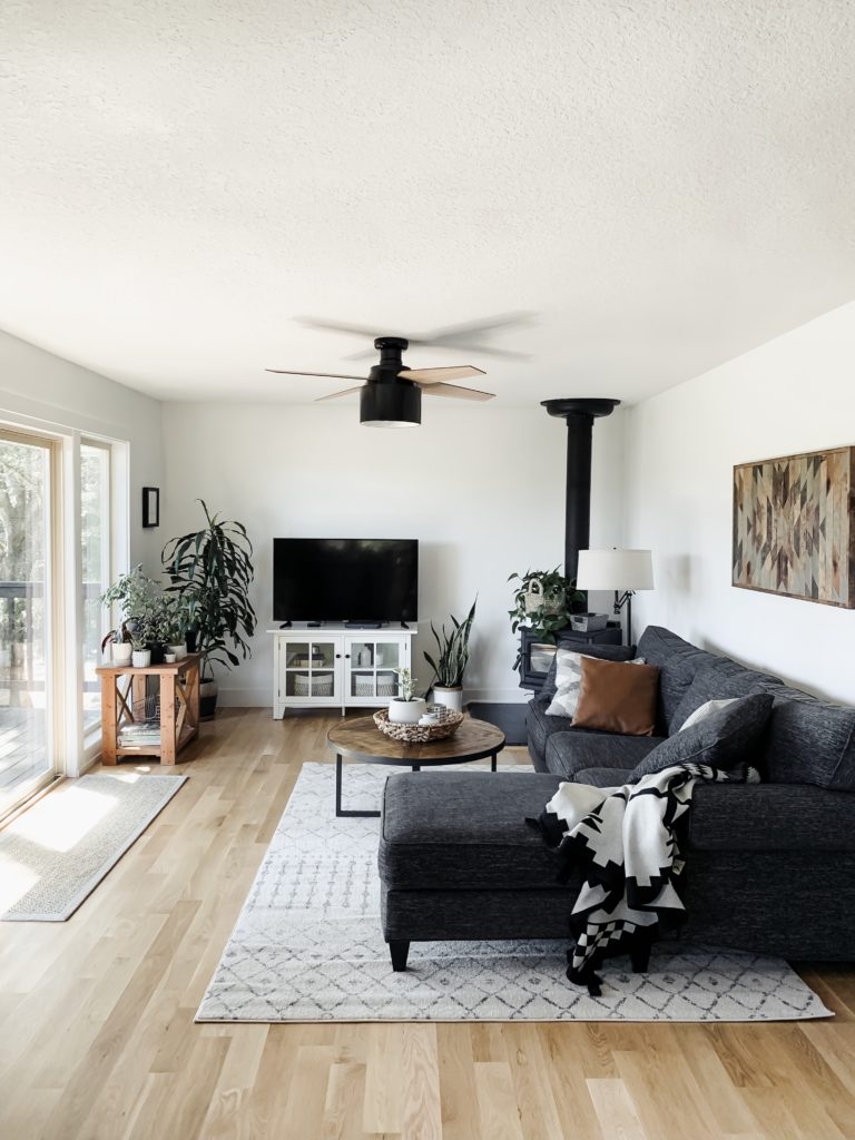 remodeled family room with neutrals, wood, and white