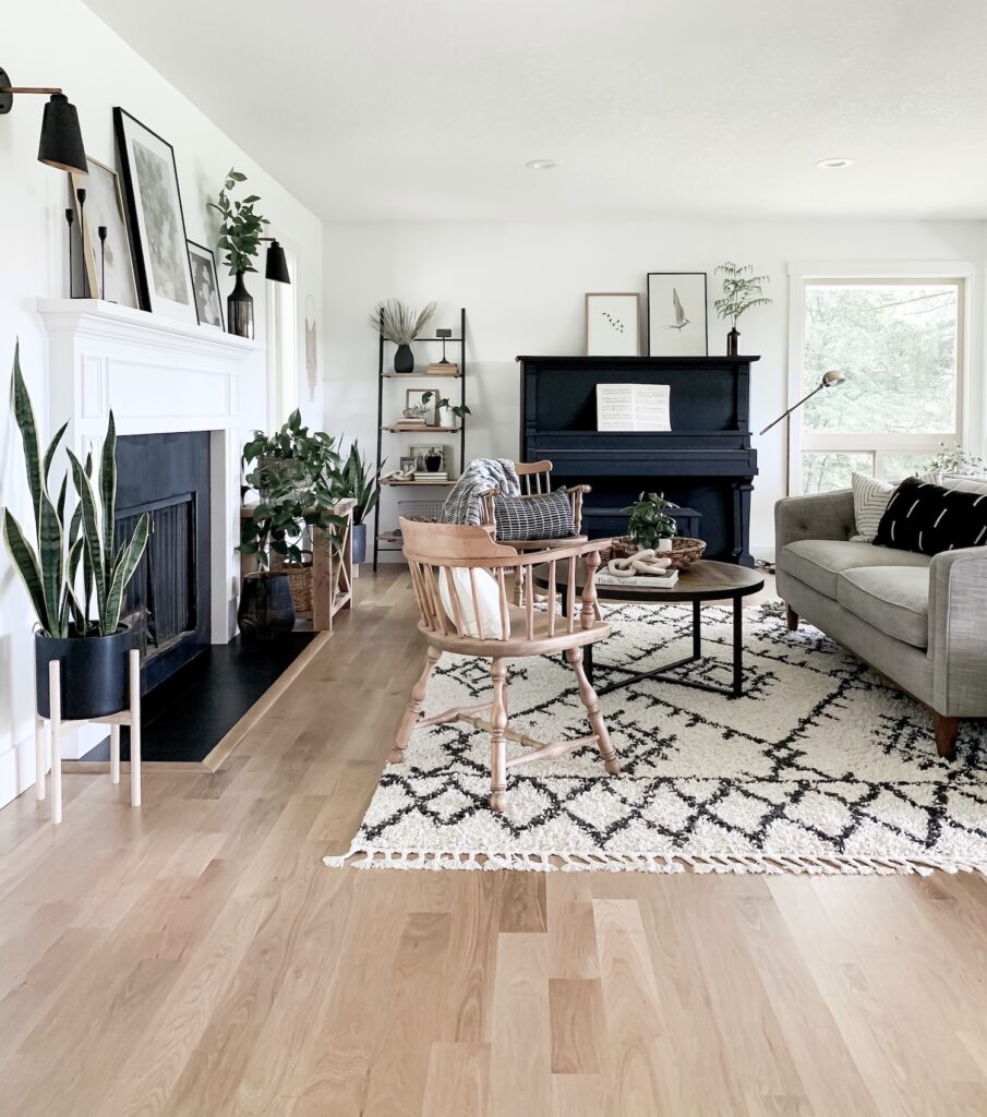 living room refresh with new rug, couch, painted piano, and neutral decor