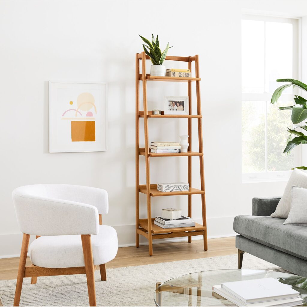 modern living room with bookcase, chair, and art
