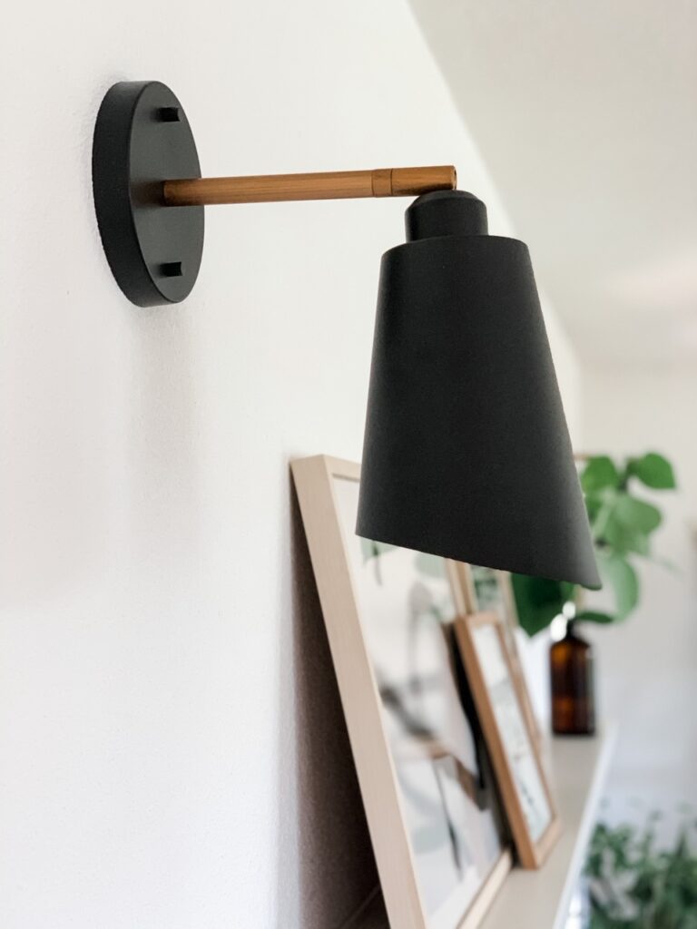 black wall sconce with puck light for lighting without hard wiring