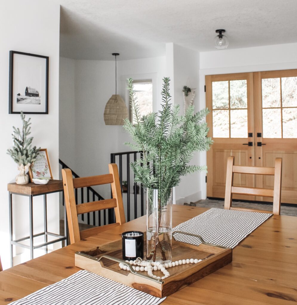 dining room with fresh greenery for holidays