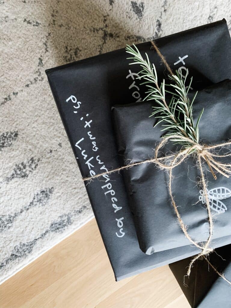 black Christmas gift wrap wit jute and rosemary