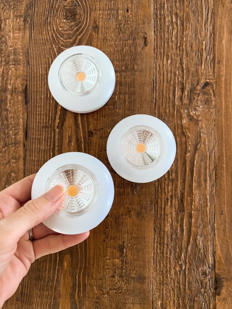 puck lights for easy DIY wall sconce without electricity