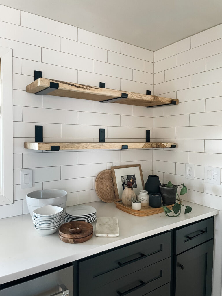 wood kitchen shelves with neutral decor pieces