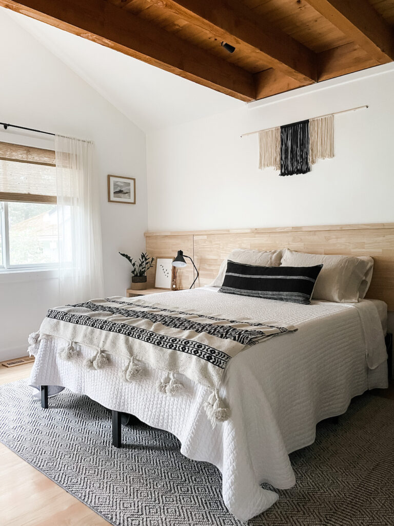 boho style bedroom with bed and large area rug