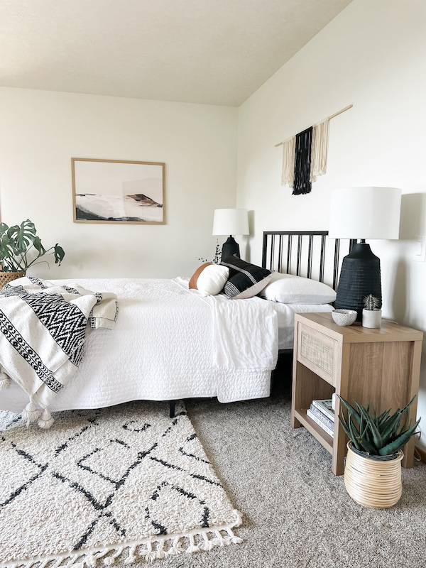 bedroom with bed, rug, and boho decor