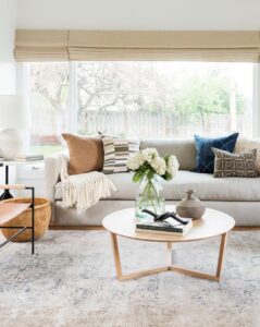 living room with round wood coffee table