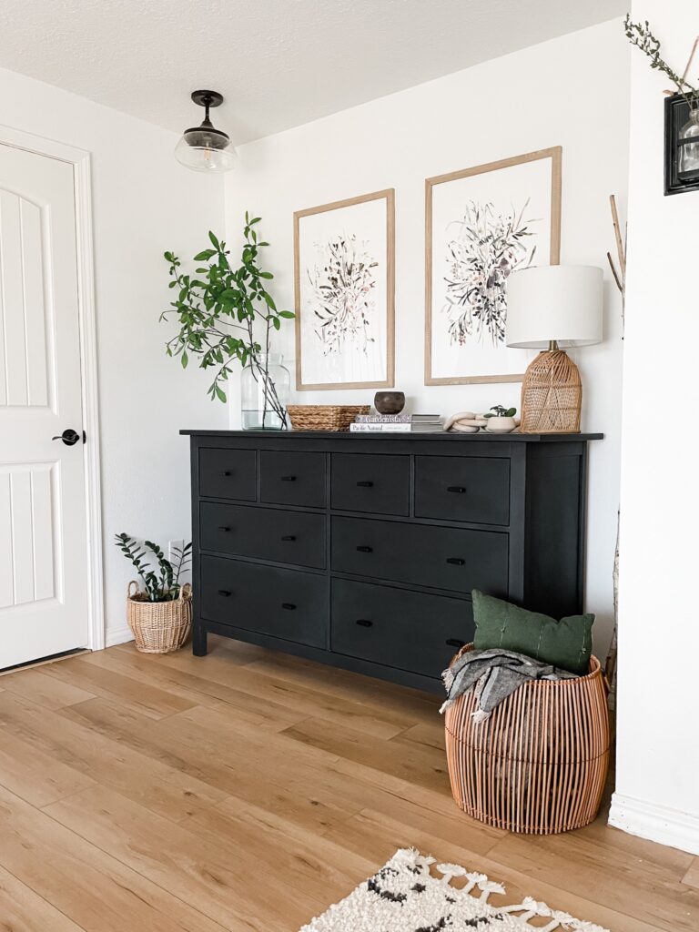 bedroom dresser with woven table lamp and other home decor