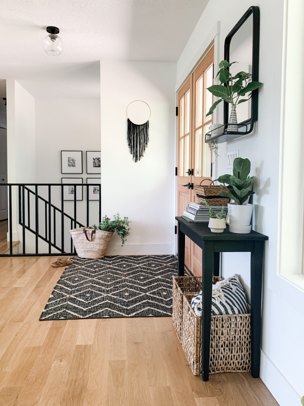 black console table with entryway decor