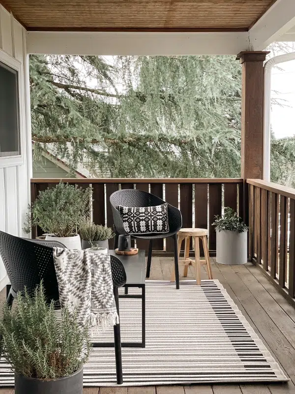 outdoor furniture on covered front porch as an outdoor living room